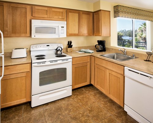 A well equipped kitchen with microwave.