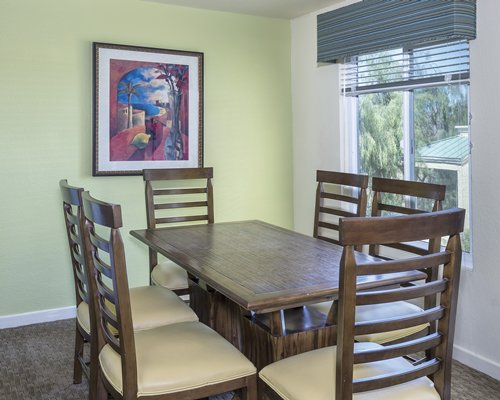 A well furnished dining area with an outside view.