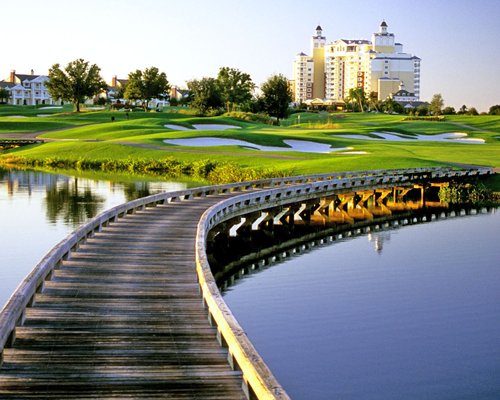 A pier leading to the well maintained golf course of the Reunion Resort & Club.