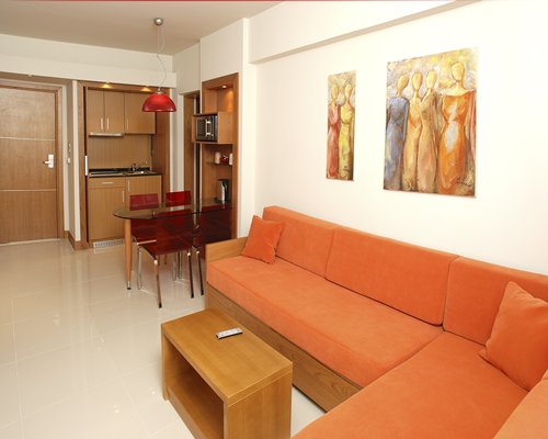 An open plan living dining and kitchen area with double pull out sofa.
