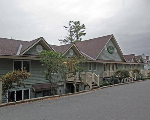 Exterior view of Sheepscot Harbour Village & Resort with stairways and landscaping.