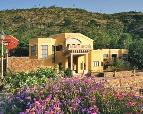 Scenic exterior view of Club Mahindra Kumbhalgarh at a wooded area.