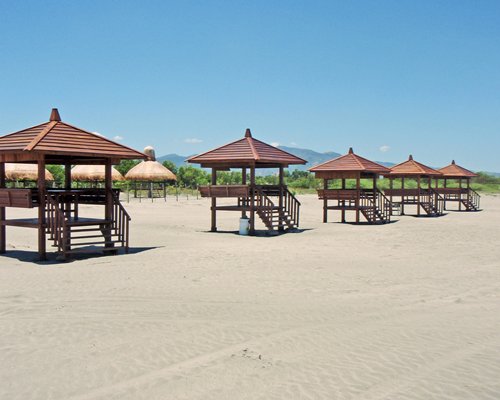 View of multiple gazebos on the beach.