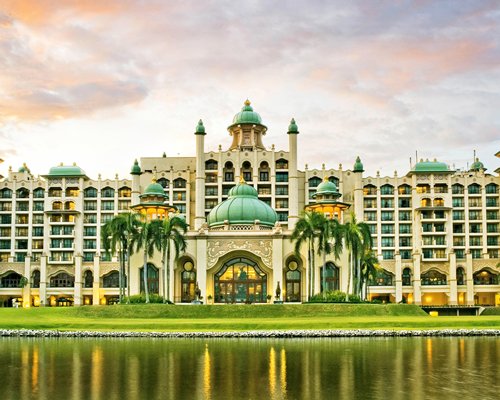 An exterior view of the Palace of the Golden Horses hotel with the waterfront.