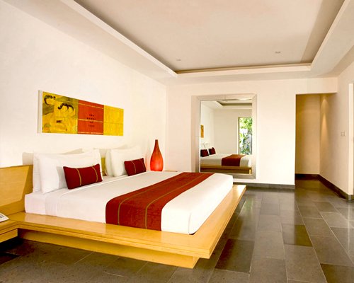 A well furnished bedroom with a king bed.