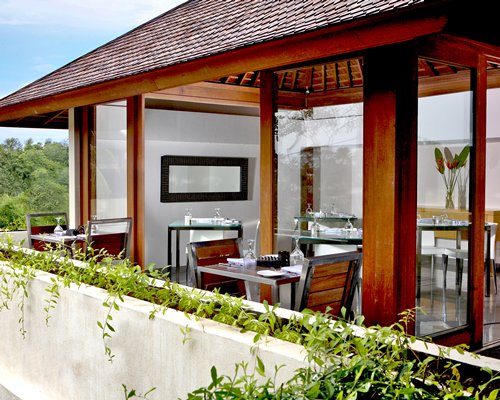An indoor fine dining restaurant with an outside view.