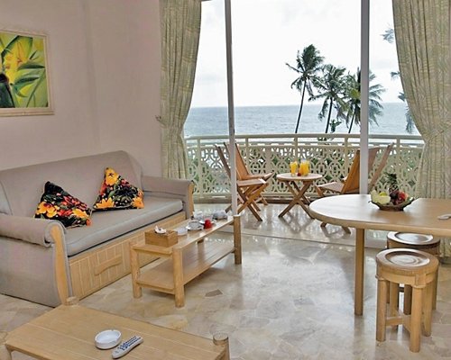A well furnished living room with a balcony.