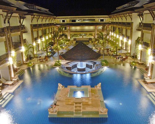 A view of the resort property with a swimming pool.