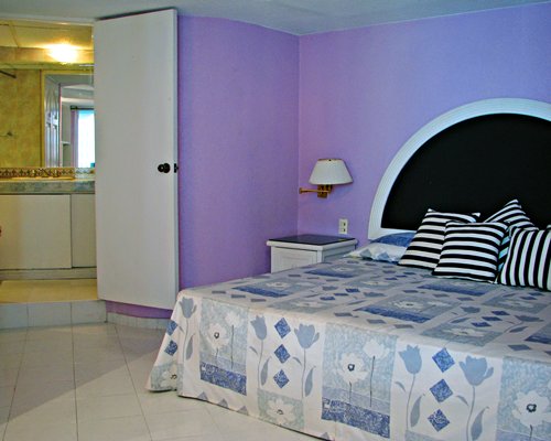 A well furnished bedroom with a double bed.
