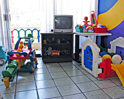 A view of an indoor play area with a television.