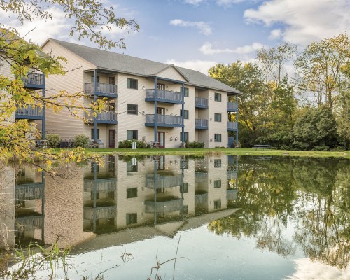 SCENIC VIEW OF THE WATERFRONT ALONGSIDE MULTI STORY UNITS.