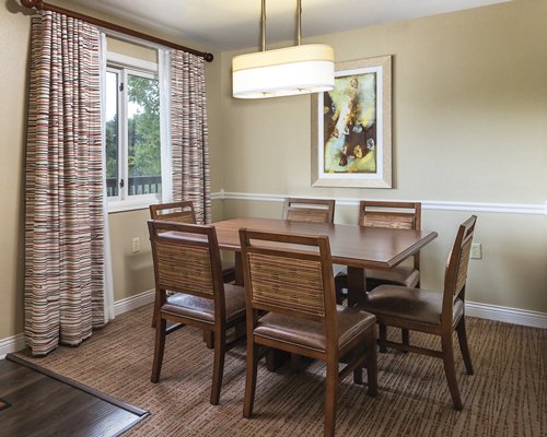 A well furnished dining area with an outside view.