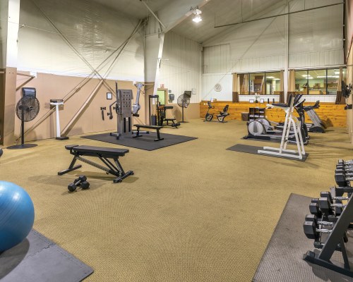 A WELL EQUIPPED INDOOR FITNESS CENTER.