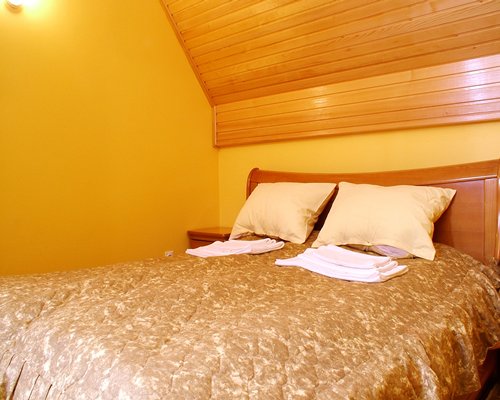 A wood paneled bedroom.