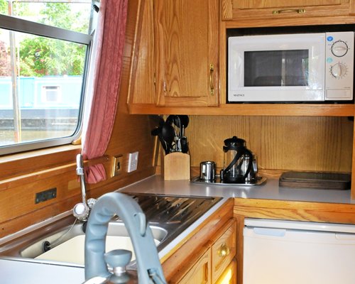 A well equipped kitchen with microwave.