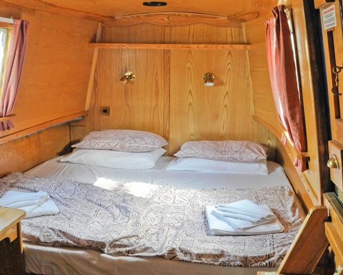 A well furnished bedroom with an outside view.