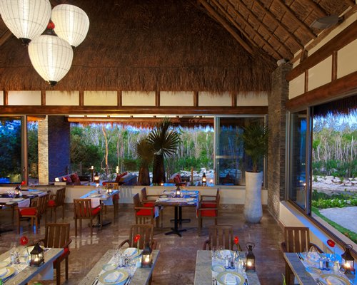 A restaurant with vaulted ceiling .