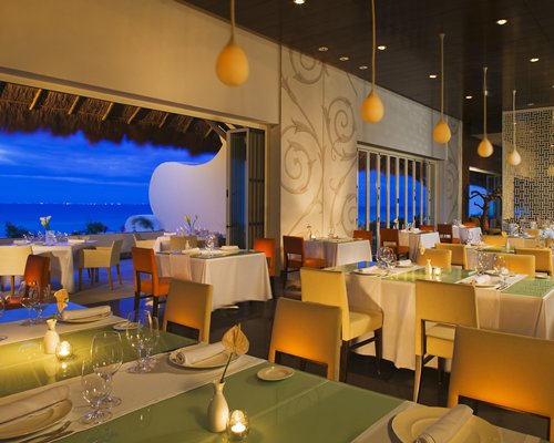 An indoor fine dining restaurant with an outside view.