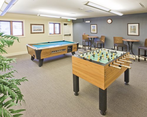 Indoor recreation room with pool table and foosball.