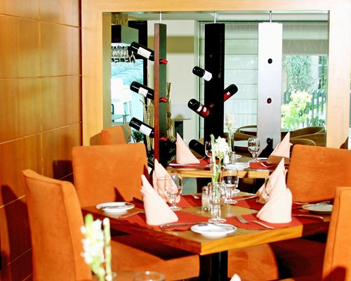 An indoor fine dining restaurant with wine rack.
