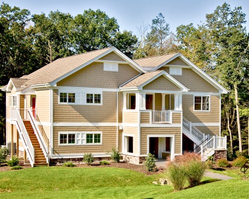 SCENIC EXTERIOR VIEW OF A UNIT WITH BALCONY AND STAIRWAY.