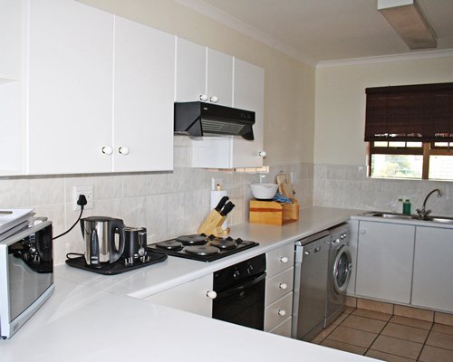 A well equipped kitchen with microwave oven.