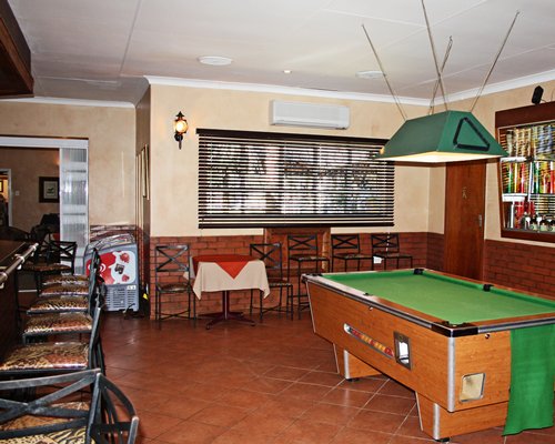 Indoor recreation room with pool table.