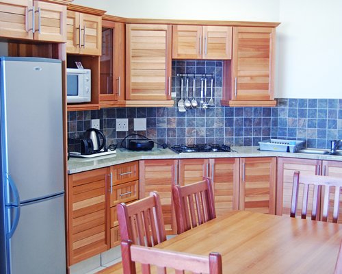 A well equipped kitchen with dining area.