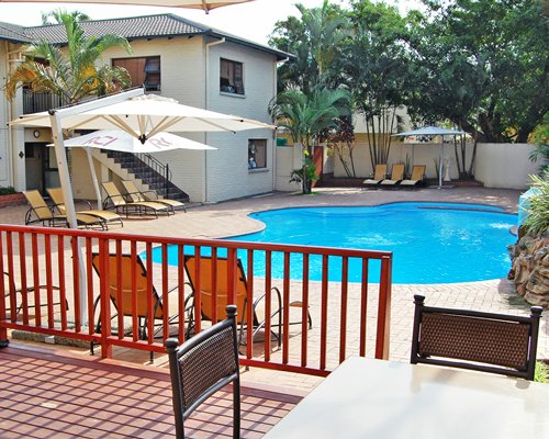 An outdoor swimming pool at Sea And Sky.