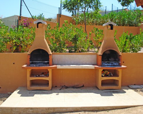 Outdoor picnic area with barbecue grills.