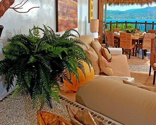 Living room with dining area and ocean view.