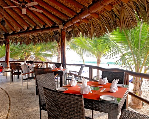 A well furnished indoor fine dining restaurant with an outside view.
