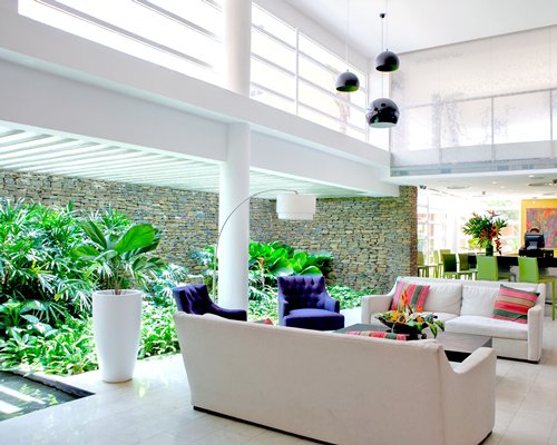 An indoor lounge area with potted plants.