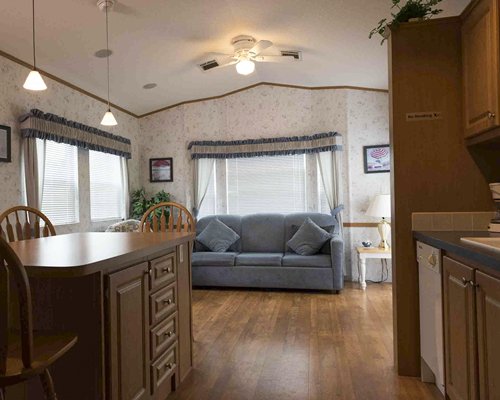 A well furnished living room with a dining area.