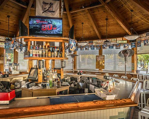 A well equipped bar with a television.