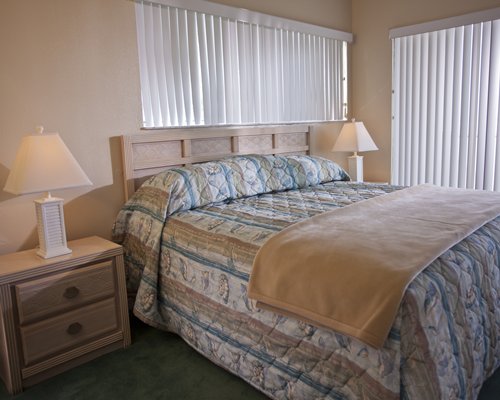 A well furnished bedroom with an outside view.