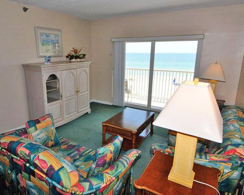 A well furnished living room with a patio.