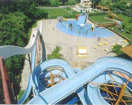 An outdoor water park with trees.