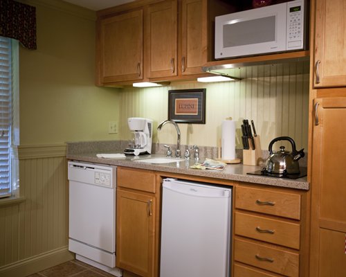 A well equipped kitchen with a microwave.