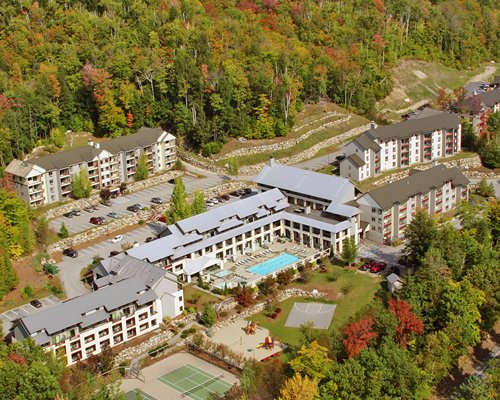 An aerial view of the resort property surrounded by a wooded area.
