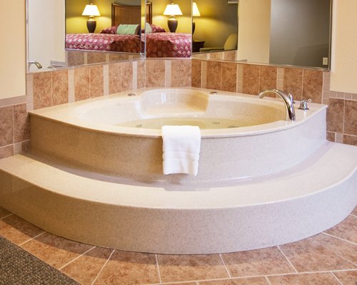 A view of an indoor bathtub.