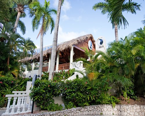 Scenic exterior view of a thatched covered unit at Presidential Suites By Lifestyle Puerto Plata.