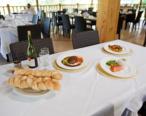 A view of various foods on a table at the indoor fine dining restaurant.
