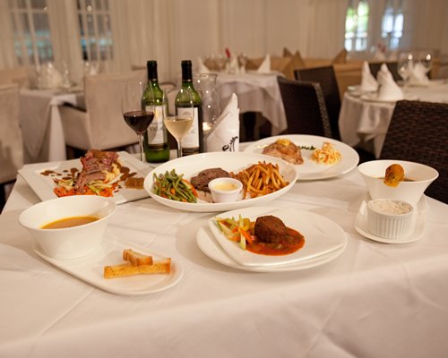 View of various foods placed on a table in a fine dining restaurant.