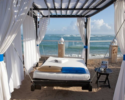 View from the beach with a covered beach bed.