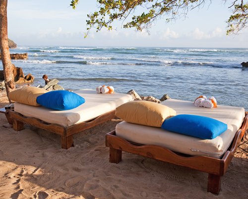 View of the beach with beach beds.