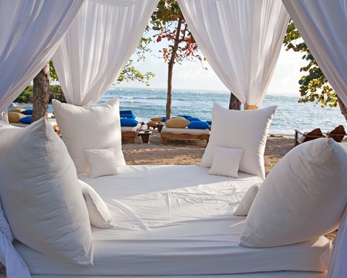 An outdoor lounge area facing the beach.
