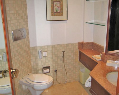 A bathroom with single sink vanity.
