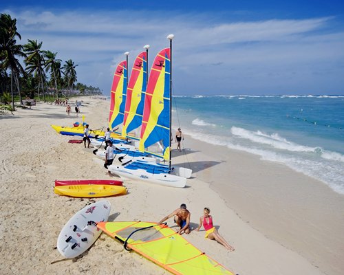 View of sailboats and kayaks on the beach.