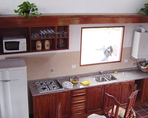 A well equipped kitchen with a microwave.